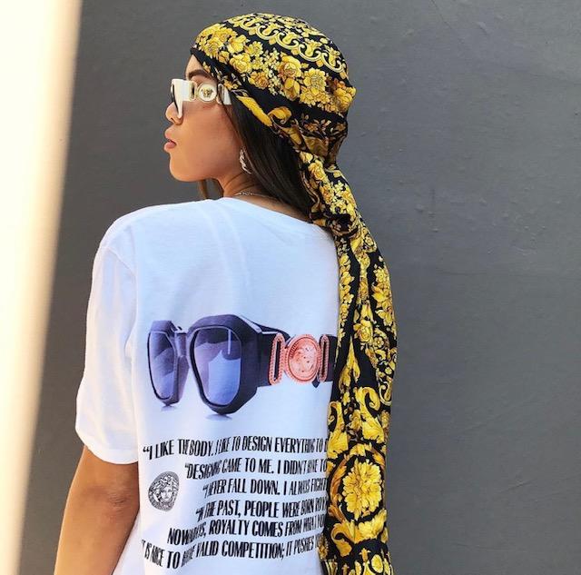 Photograph showing the back of a white Gianni Versace tribute collection shirt