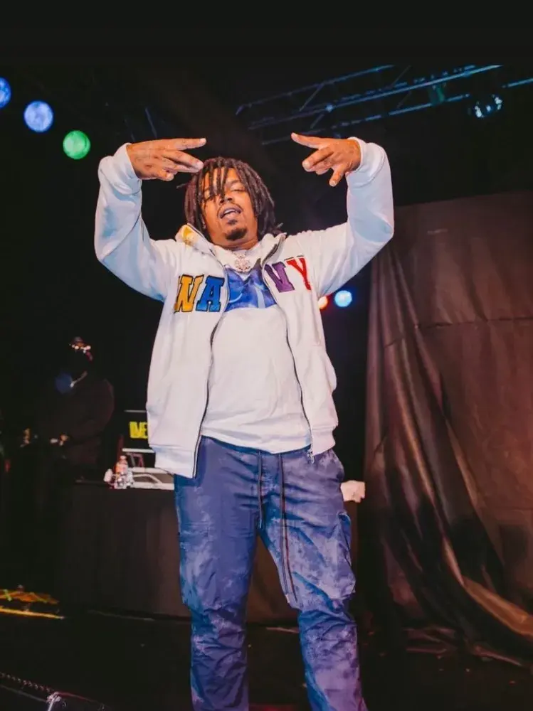 Performance photograph featuring a light-colored WavyNavy hoodie.