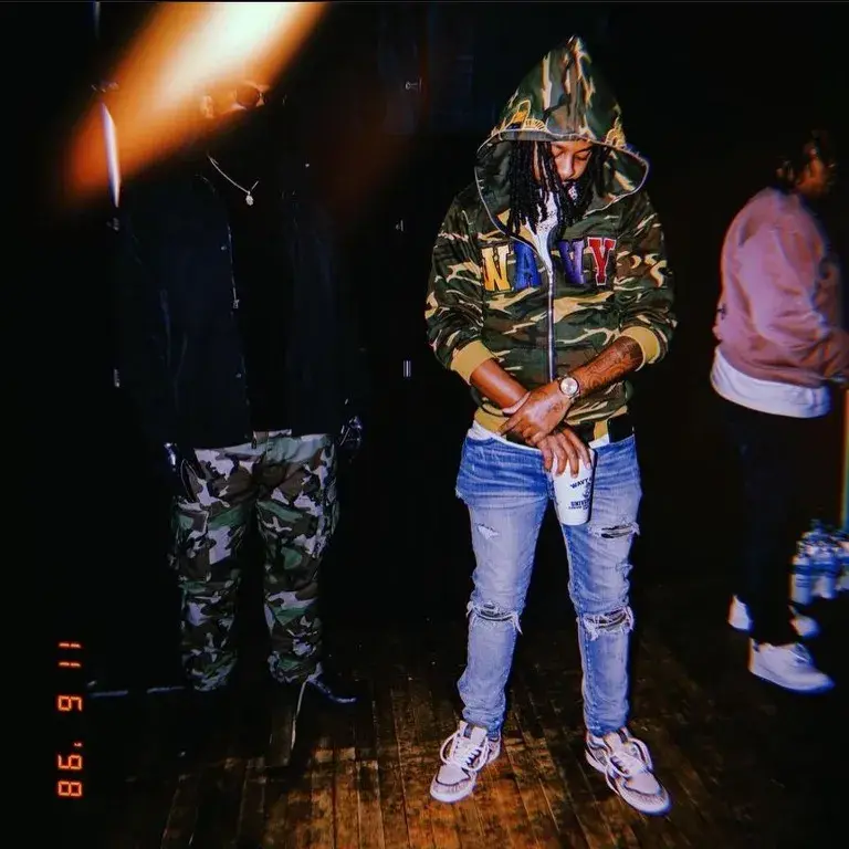 Performance photograph featuring a camouflage WavyNavy hoodie.