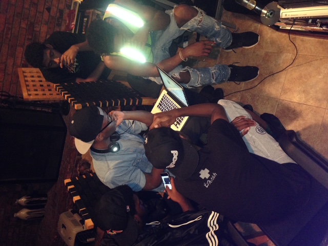 Westhouse collaborators gathered around a laptop in a working session.