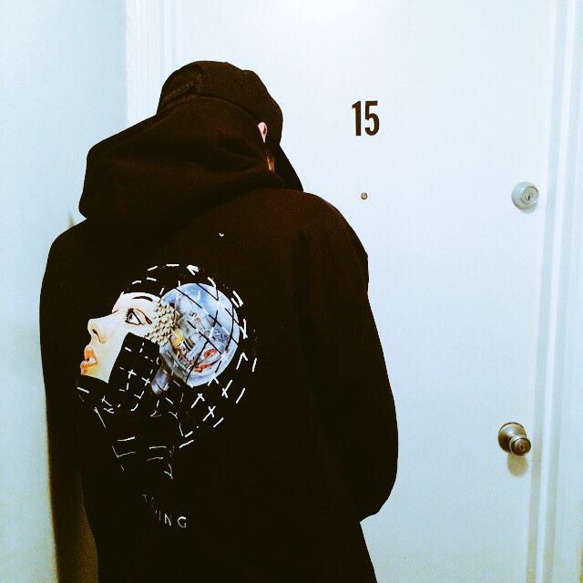 Person wearing a black Westhouse hoodie with a large illustrated back graphic.